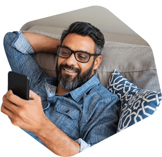 Smiling man looking at the phone